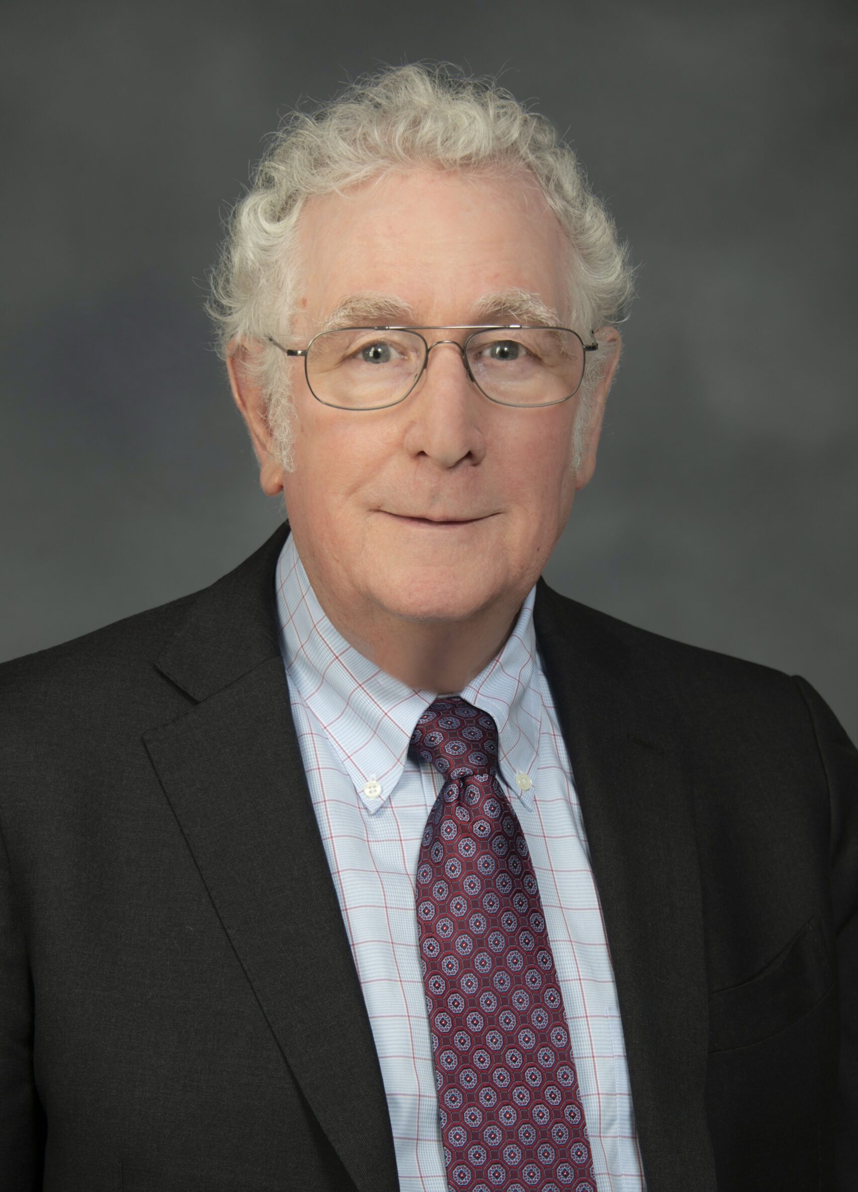 Professional portrait of a man in suit and tie